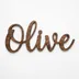 Scalloped walnut-stained nursery name sign with a child's name and small hearts laser-engraved into the face.