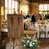 Personalized wedding seating chart sign in walnut-stained birch, guest names arranged in tidy columns., view 3