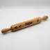Rolling pin engraved with the name "Sofia" in the same script style and flower placement, showing personalization with a different name