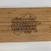 The whole bamboo board seen square on, rounded corners and vertical bamboo grain running the length of the face