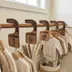 Safari closet dividers hanging in order on a nursery closet rod, sorting baby clothes by size