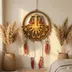 Layered wood zodiac wall art styled on a wall in a decorated room